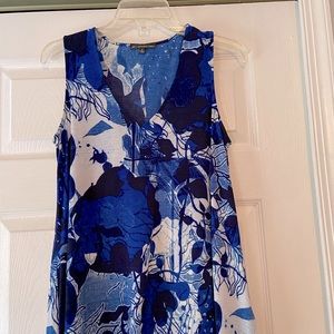 Vibrant blue and white V-neck sleeveless tunic blouse.